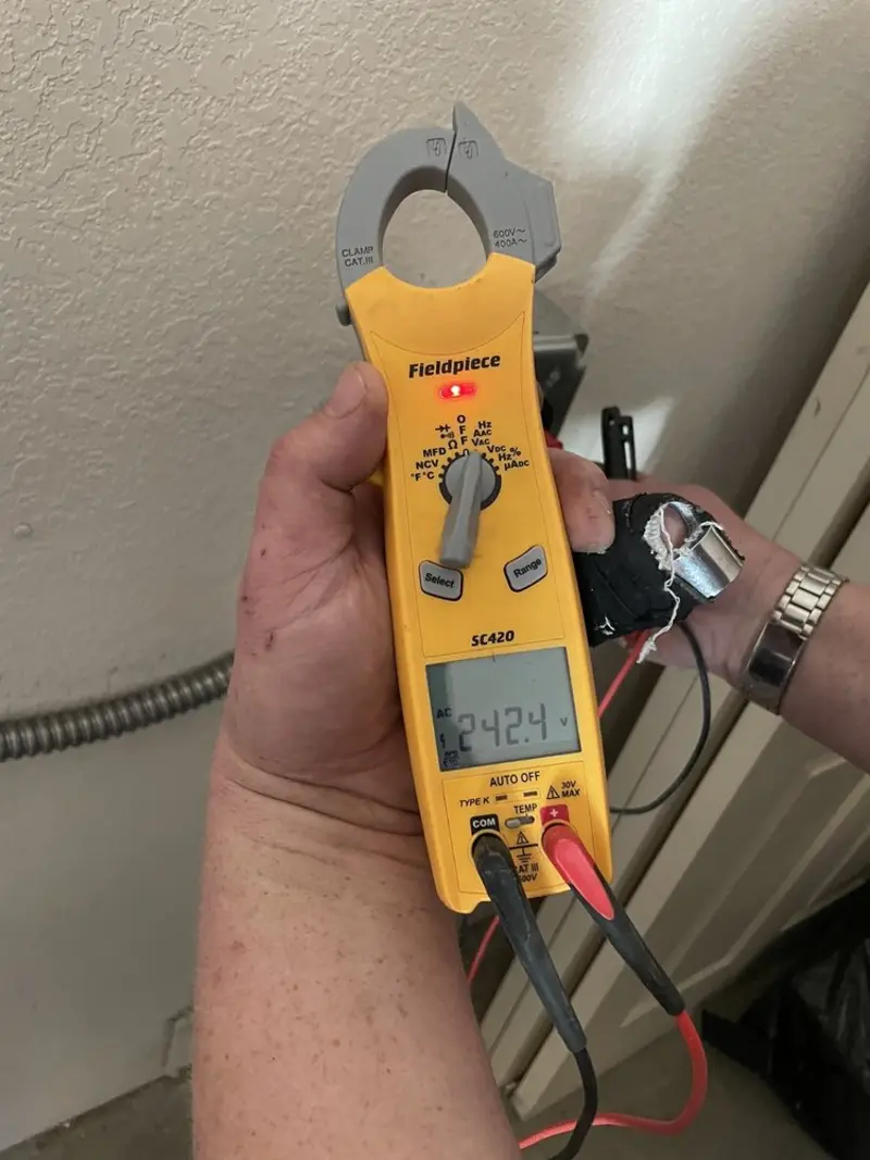 Voltage testing with clamp meter during Ceiling Fan Installation in Spearfish